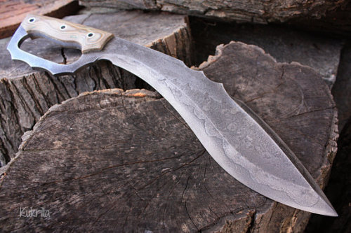 gunsknivesgear:  Kukrilla. This D-guard kukri is an awesome modern design.  You can stab, hack, punch with the guard and hammer with the pommel.  Deadly at both long range and infighting. 