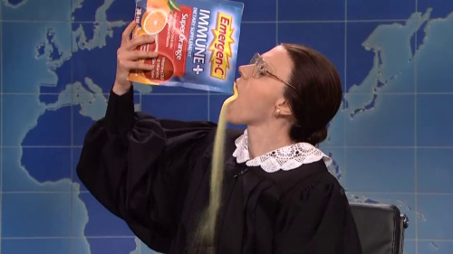 [Image is Kate McKinnon from SNL portraying Ruth Bader Ginsburg. RBG is pouring a large bag of Emerg