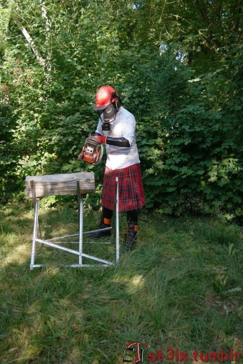 The Rubber Highland Games 2018 - Part 4 of 7Rubbered husband cutting wood in the garden