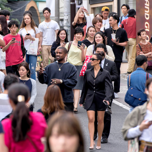 Kanye West and Kim Kardashian casually strolling down Cat Street in Harajuku today. They walked pass