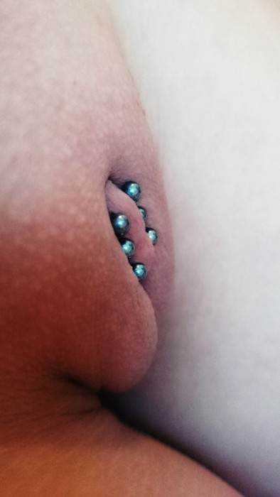 pussymodsgaloreShe has pierced inner labia with three barbells through them. Chastity