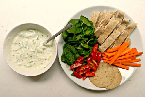 Lunch - wholemeal pittas, carrot sticks, spinach, baby plum tomatoes, VBites turkey slices and homem