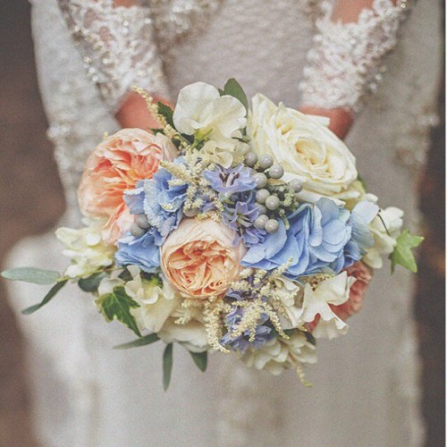 We’ve been spotting soft blue and peach bouquets popping up here and there, and we think it mi