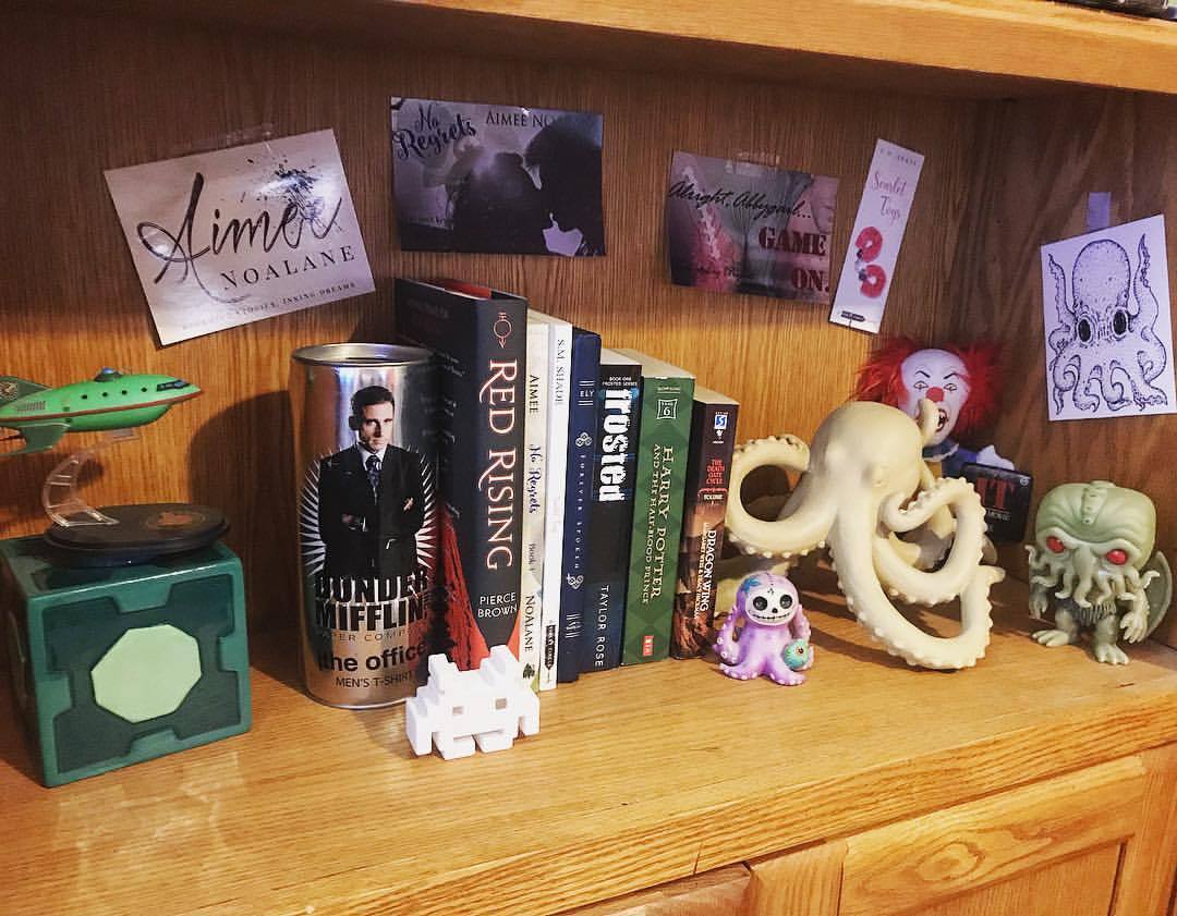 My nerdy shelf is all set up! My favorite knickknacks & author swag & signed books & the HP book I was proposed with ❤️❤️ #nerdlife #bookworm #bookstagram #rickandmorty #octolove #futurama #chthulu #michaelscott
