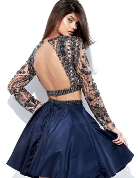 Eclectic beading adorns the crop top with scoop neckline, long illusion sleeves and triangular cutou