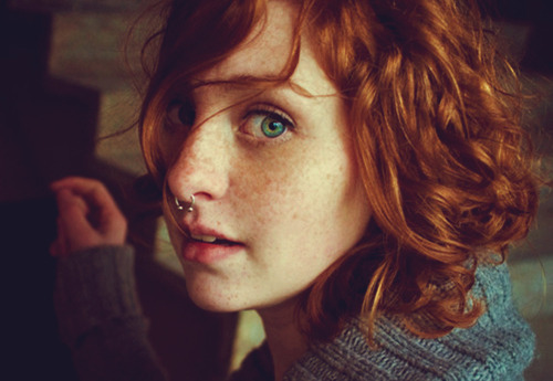 Girl with red hair freckles green eyes