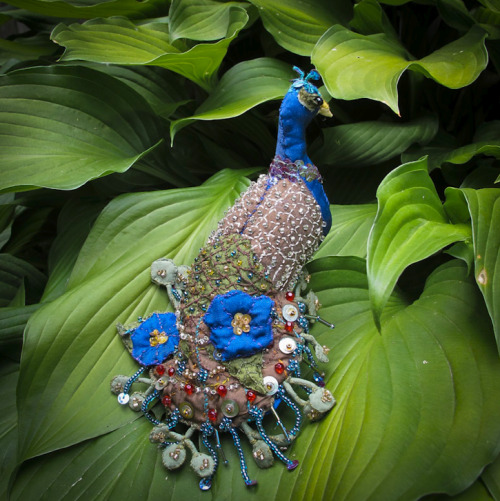 Adorned in leaves and morning glories.
Handmade peacock (available at my etsy if you are so inclined.)