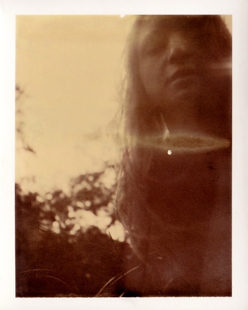 My first scan on my new scanner - Chocolate Polaroid from spring 2012 with Baddog