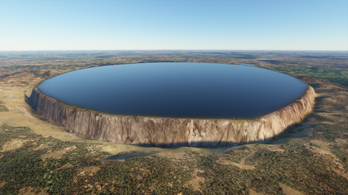 An incredibly steep-sided mesa is topped with a mirrorlike lake stretching out to its edge. The mesa walls are probably thousands of feet tall.