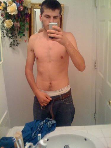undie-fan-99:  Guy showing off in (what appears to be) his white Hanes boxerbriefs.