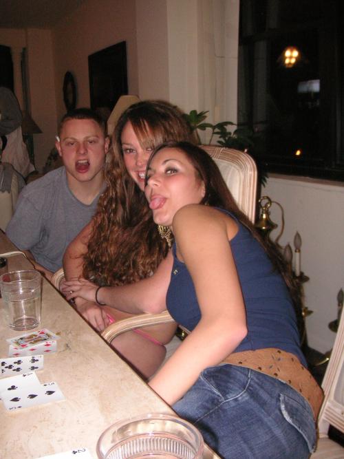 Photo set of girl losing at a strip card game.