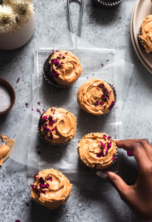 fullcravings:Moist Chocolate Cupcakes with Caramel Cream Cheese Frosting