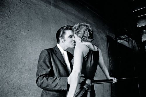 Elvis Presley and his date, backstage at the Mosque Theater,  Richmond VA: June 30, 1956. - Alfred W