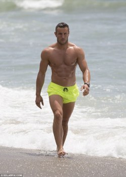 thecelebarchive:  Elliott Wright​ showed off his muscles as he hit the beach in Spain on Monday.Pictures Gallery &gt; http://bit.ly/tcaelliotwright