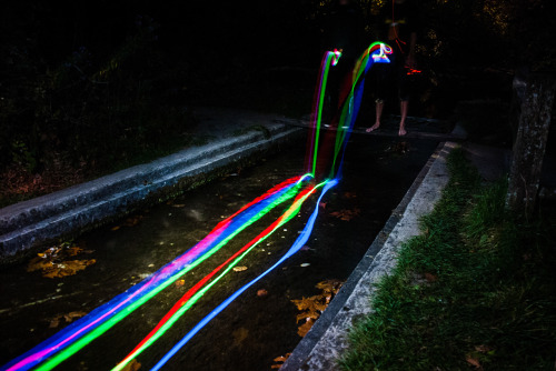 fromthelenzmedia:  Neon Falls. Light trails of glowsticks shown through the movement of the water. 