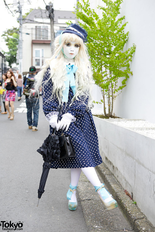 Japanese shironuri artist Minori on the street in Harajuku in summer of 2014 wearing a handmade/rema