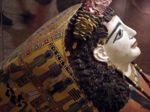 Mummy mask of woman wearing a jeweled garland. Made of plaster, cartonnage and paint, 1st c. A.D.