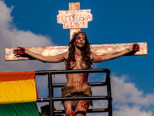 proud-atheist:  Transexual Jesus on the cross at Brazil’s Gay Parade is making people flip their shit. The sign above her head says “Stop homophobia”.http://proud-atheist.tumblr.com
