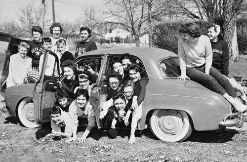 Sorority sisters fro Alpha Delta Pi and Delta Zeta pack into a tiny Renault to try and set a record of 27 women in a car. Car packing was a fad that swept across America in the late 1950’s and early 1960’s.