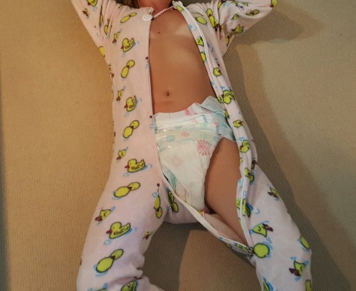 diapers4eva:  qld-daddy:   After gracie’s nap she had some lunch and a bottle of apple juice.  Then daddy noticed she soaked through her nappy and left a wet spot on the carpet where her foot was.  I guess 2 boosters are not enough for this heavy little