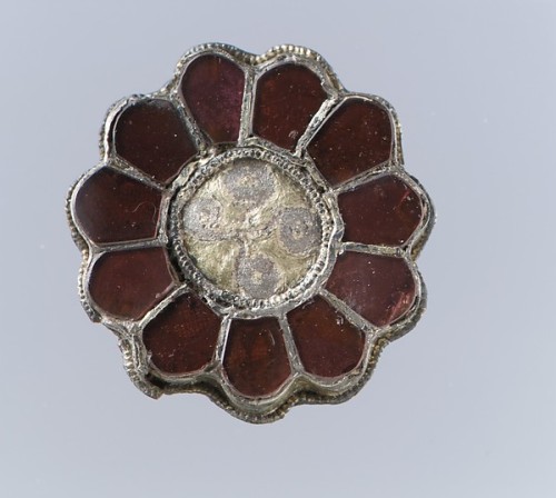 Frankish silver-gilt and garnet brooches, 6th centuryGarnets, worked in the cloisonné technique, fea