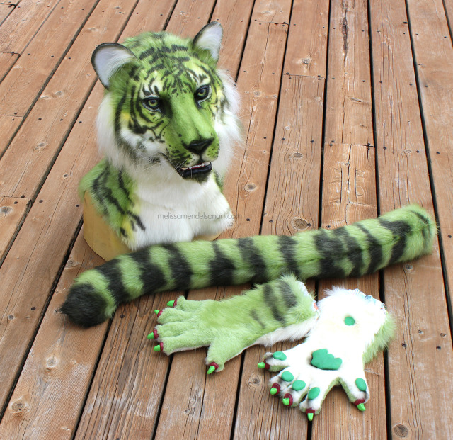 This jade green tiger is looking for a couch to lounge on! This pretty kitty comes with hands and a tail, and the mouth 