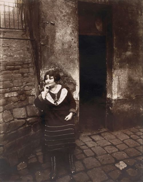 Eugene Atget, La Villette. Rue Asselin, prostitute waiting in front of her door, 1921 Nudes &amp; Noises  