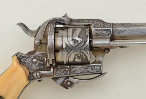 An engraved Lefaucheux pinfire revolver with folding trigger and ivory grips.  Belgian proof marks, 