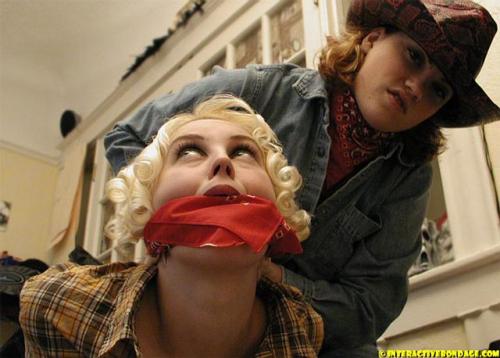 graybandanna:  Cowgirls taking turns tying each other up and making good use of their red bandannas
