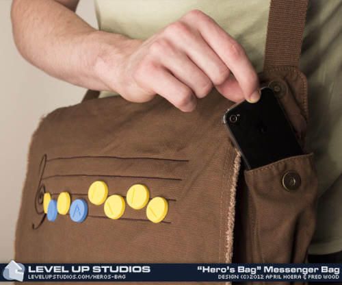 pwnlove:  Musical Hero’s Bag Break out the ocarina, Wind Waker, harp or flute to play your favorite Legend of Zelda tune off these new messenger bags from Level Up Studios. Each messenger bag comes with ten rubber song note pins so you can compose your