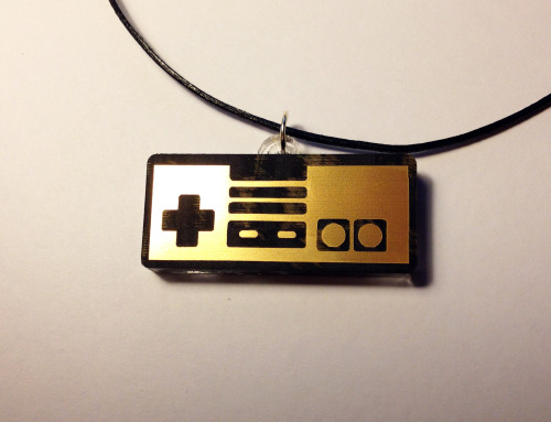 the-daily-robot:  New Laser-etched NES and SNES gamepad necklaces (in gold or silver!) available at The Daily Robot’s Etsy store!