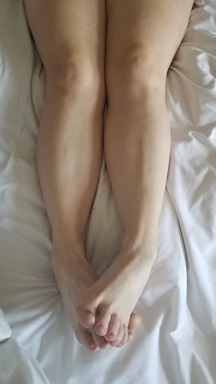 My pretty wifes beautiful legs and feet snuggling in bed this morning.please comment