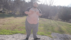 XXX 0nigum0:A fat man attempts to get a little photo