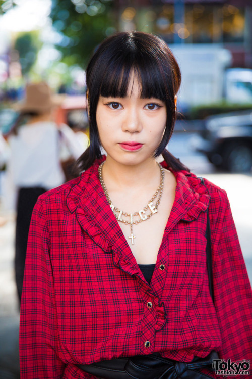 18-year-old Hanano on the street in Harajuku wearing a belted plaid dress with fishnet socks and bow