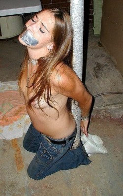 violatedandshamed:  sexy. time to take that duct tape off and rape that whore mouth?