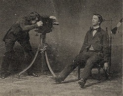 A post-mortem photographer at work. 19th