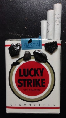 alpine-anarchist:  A pack of my favorite cigarettes, and some obsidian shards of fire H.