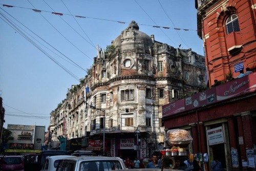 Domineering colonial remainders towering over local activities as life continues to go on on the ver