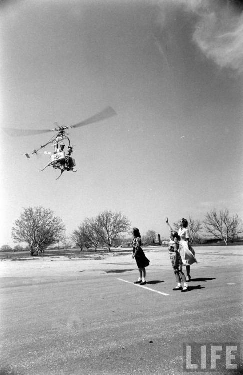 There goes Dad in his personal helicopter(Ralph Crane. 1954?)