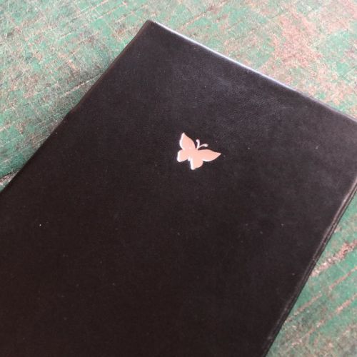 Gilding in silver color.www.gatzbcn.com #bookbinding #handmadejournal #silverbutterfly #artisanh