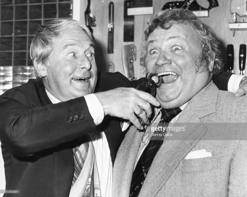  Ernie Wise and Harry Secombe joking around at the Ideal Home Exhibition, London, March 5th 1979. 