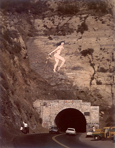 westside-historic:


One Saturday morning, on October 29, 1966, a massive 60-foot-tall painting of a nude pink lady holding flowers suddenly appeared as you headed into the tunnel on Malibu Canyon Road.
A 31-year-old paralegal from Northridge, a woman named Lynne Seemayer, showed up on the road and admitted that she was the artist who did the piece.
Seemayer said that she was annoyed by the graffiti that was all over the canyon wall (“Valley Go Home” was a memorable slogan) and so, over a 10 month period, she started to secretly climb up under the moonlight and suspended herself by ropes to remove the graffiti.


At 8 P. M. on October 28 Seemayer painted the Pink Lady using ordinary house paint. By dawn it was done.


Source: https://boingboing.net/2009/12/01/the-story-of-the-pin.html #VALLEY GO HOME  #HAHAHAHAHA THAT IS THE FUNNIEST MOST LA SHIT  #good for her  #a tunnel well known to me  #worthless homesickness tag