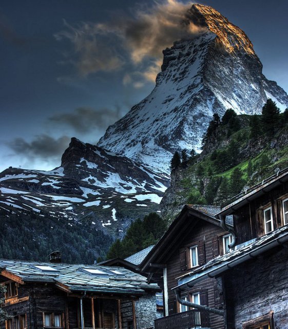 To dwell in the shadow of a giant (Zermatt village, Switzerland, at the foot of