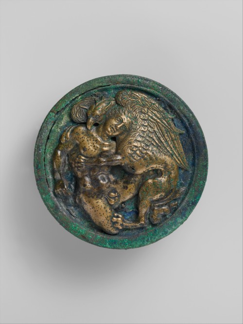 via-appia:Bronze lid and upper part of an oil flask, youth attacked by a griffinPraenestine, 4th cen