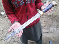 badger-actual:  Damascus Hunting Sword. 