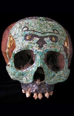 virtual-artifacts:  Human skull decorated with a polychromic mosaic • Mixtec-Aztec, Mexico • 1300-1521 A.D. • Tessels of turquoise, hematite and tumbaga gold sheets • H. 14.5 cm • Private collection 