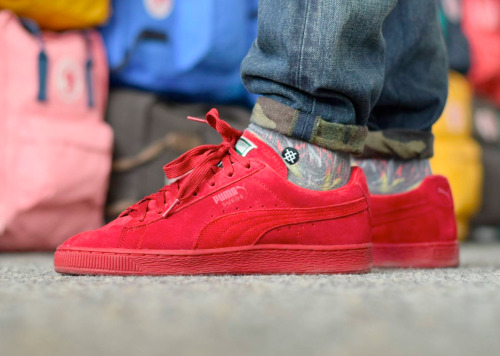 all red pumas on feet