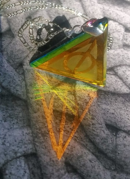 Harry Potter, Deathly Hollows cold worked dichroic glass jewel by Richard Elvis. This pic shows a li