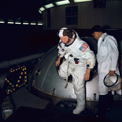 Frank Borman, Apollo 8 commander, egresses the gondola in Building 29 after centrifuge training in t