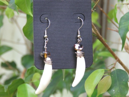 taste-of-envy:Did you know I make jewelry out of bones!?!Well now you do! Now available in my store Coyote Fang earrings along with other goodies! Everything is made by hand by me and the animal remains are treated with great respect and care <3Get